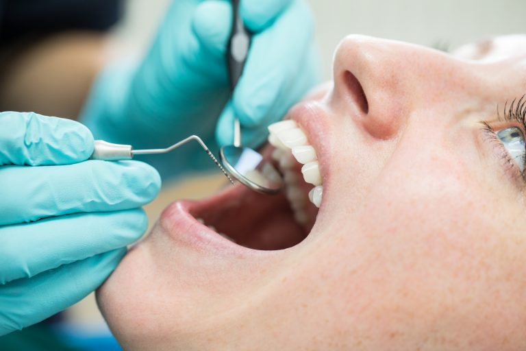 Woman getting a dental check-up at dentistry